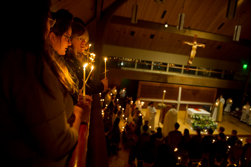 Students holding candles at Easter Vigil